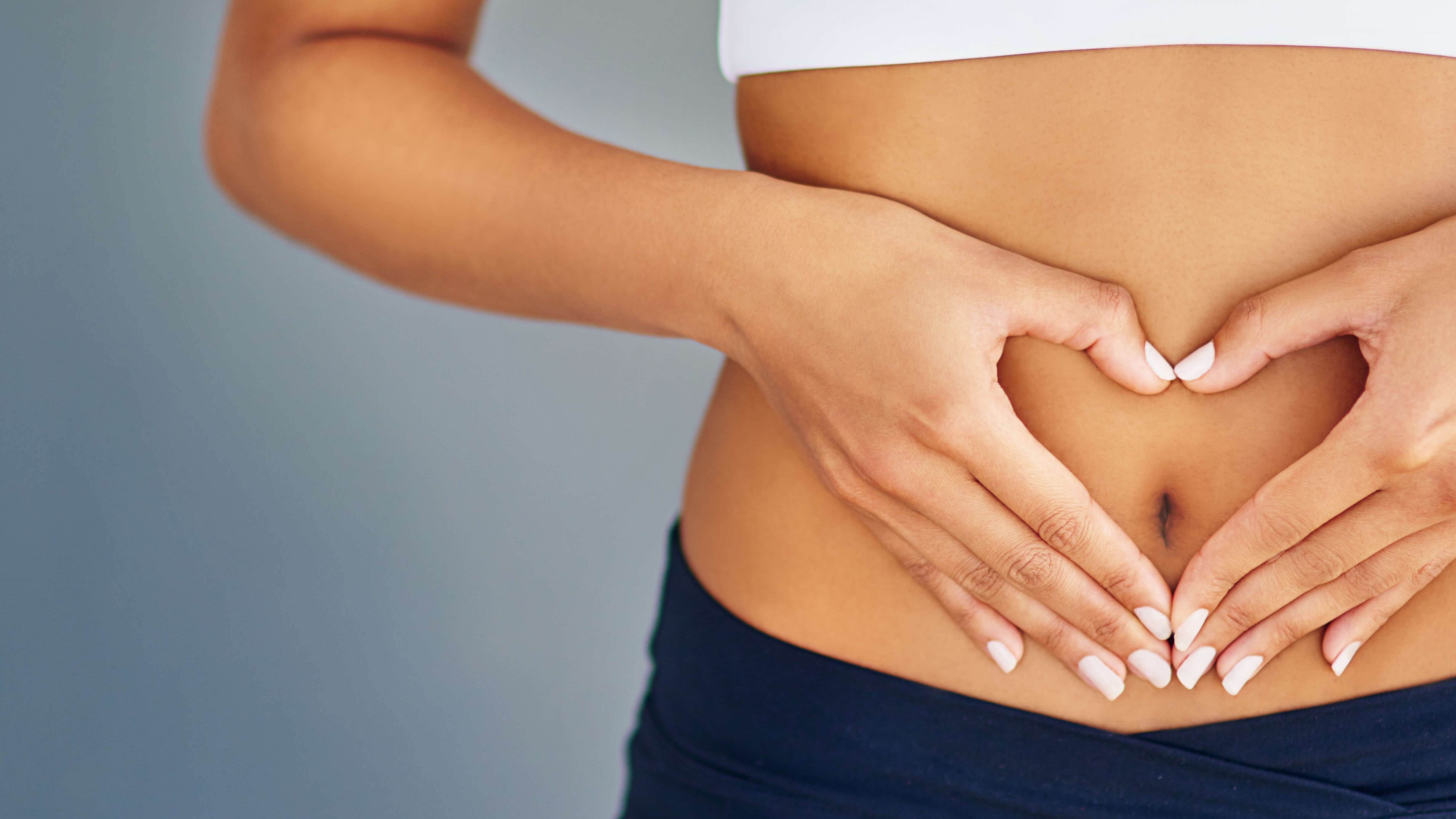 woman holding her belly